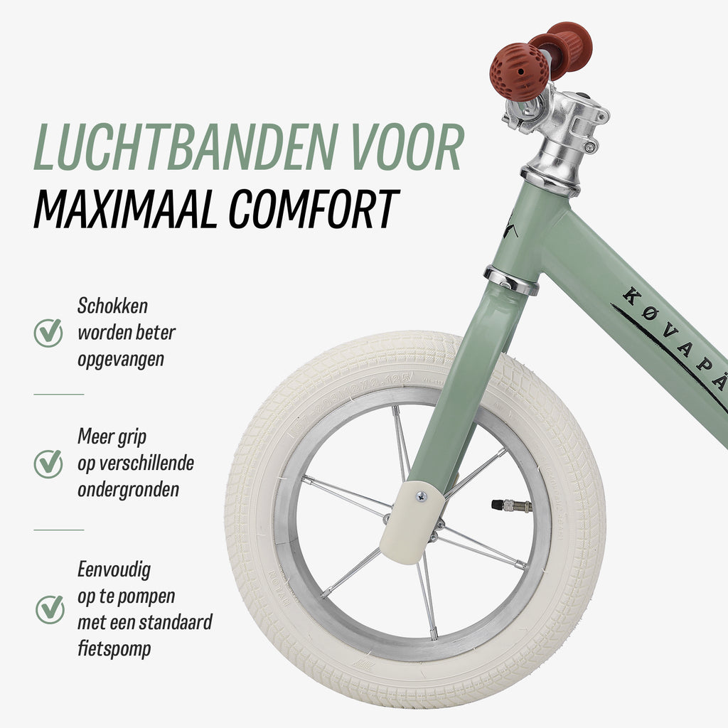 luchtbanden op groene Køvapää loopfiets voor extra comfort