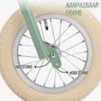 luchtbanden op groene Køvapää 2-in-1 loopfiets voor extra comfort